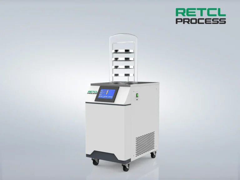 A compact benchtop freeze dryer with a clear chamber and digital controls, designed for efficient laboratory sample drying.