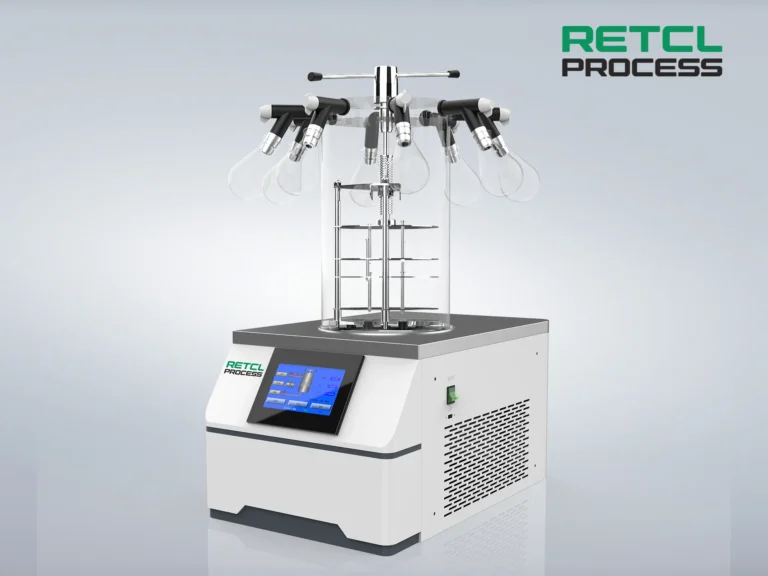 Alt text: A modern Benchtop Freeze Dryer with a digital interface, manufactured by RETCL PROCESS, featuring multiple flasks attached to a manifold on top.